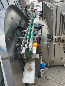 Conveyor Label Applicator to Steam Tunnel